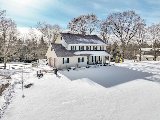 view of snow covered house