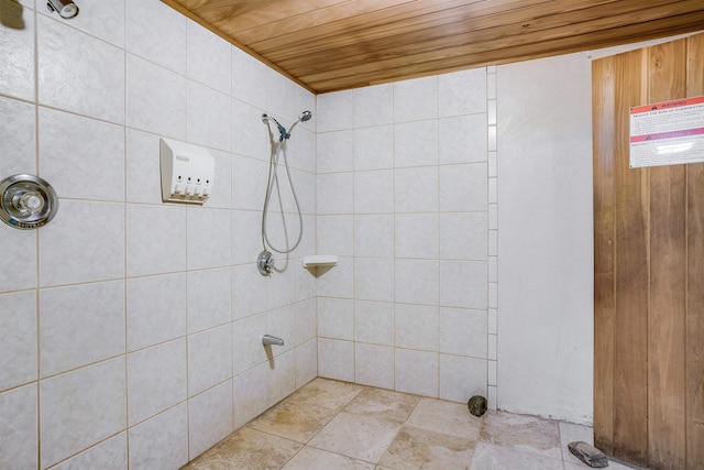 bathroom with wooden ceiling and tiled shower