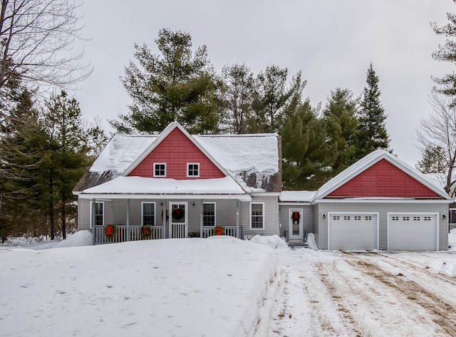 view of front of property featuring an attached garage and covered porch