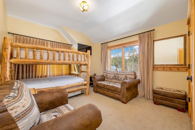 bedroom with light carpet and vaulted ceiling