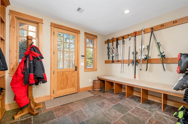 mudroom featuring baseboards, visible vents, recessed lighting, and stone tile flooring