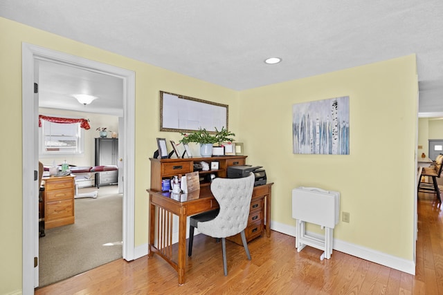 office featuring light wood-type flooring, baseboards, and recessed lighting