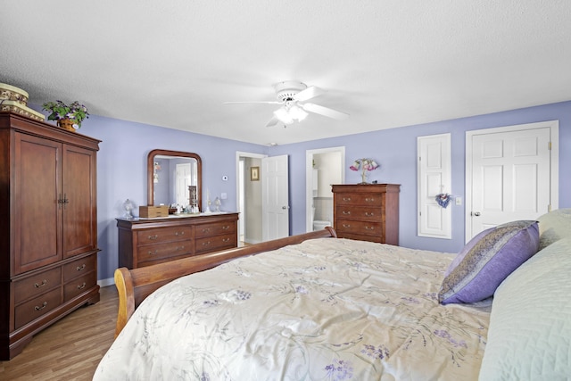 bedroom featuring light wood-style floors and a ceiling fan