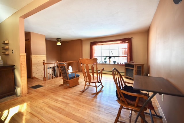 dining space featuring visible vents and light wood-style flooring