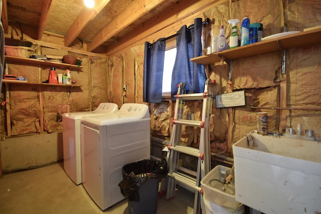 laundry area featuring a sink and washing machine and dryer