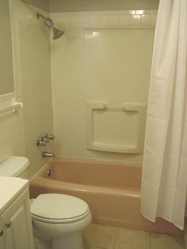 full bath featuring tile walls, toilet, shower / bath combo, vanity, and tile patterned floors