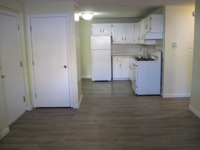 kitchen featuring white appliances, light countertops, backsplash, and white cabinets