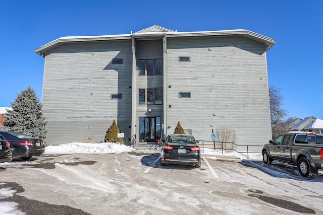 view of front of home featuring entry steps and uncovered parking