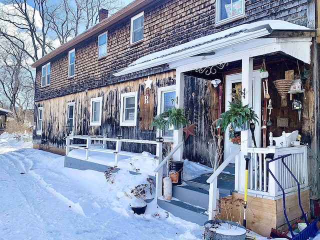 view of front of house with a chimney