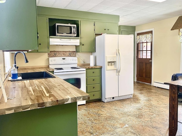 kitchen with green cabinets, white appliances, a sink, and under cabinet range hood