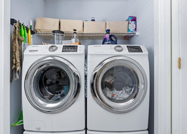 laundry area with laundry area and washer and clothes dryer