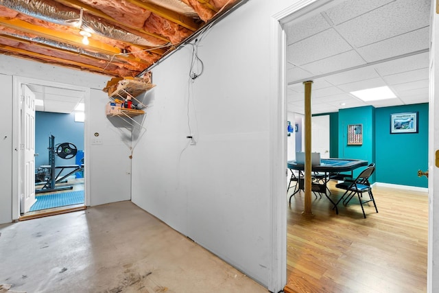 basement featuring a drop ceiling