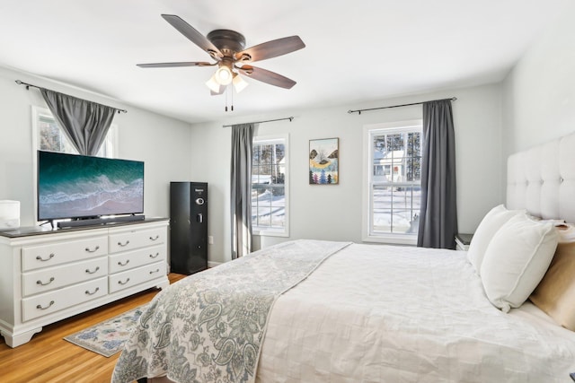 bedroom featuring wood finished floors and a ceiling fan