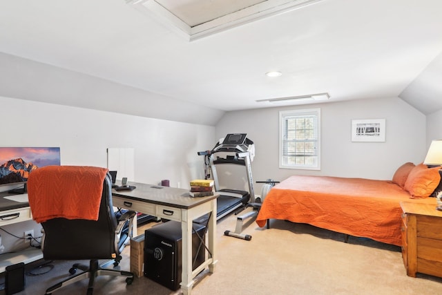 carpeted bedroom with visible vents and vaulted ceiling