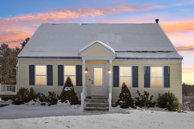 bungalow-style house with entry steps