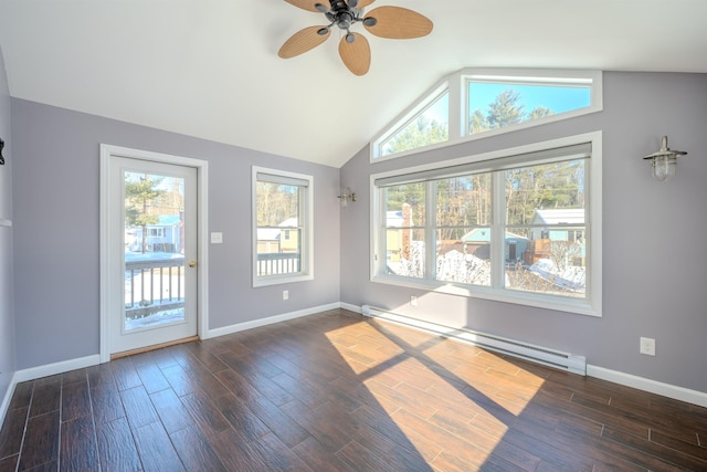 empty room featuring lofted ceiling, ceiling fan, a baseboard radiator, dark wood-type flooring, and baseboards