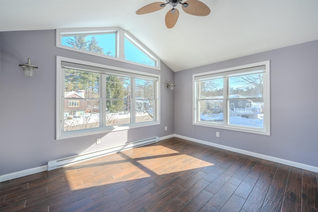 unfurnished room featuring a baseboard heating unit, baseboards, dark wood finished floors, and lofted ceiling