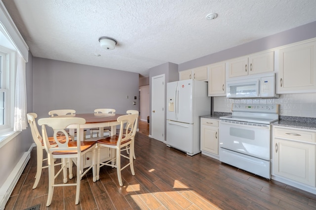 kitchen with a baseboard heating unit, white appliances, white cabinets, and dark wood-style flooring