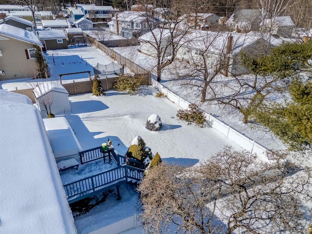 snowy aerial view with a residential view