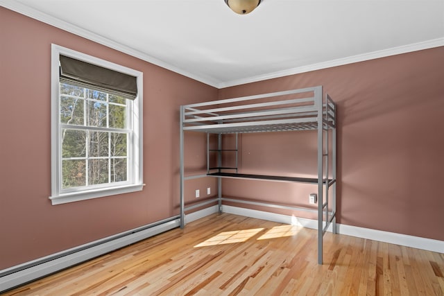 unfurnished bedroom with light wood-type flooring, a baseboard radiator, baseboards, and crown molding