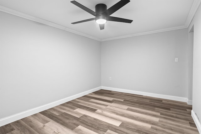 unfurnished room featuring ceiling fan, ornamental molding, wood finished floors, and baseboards