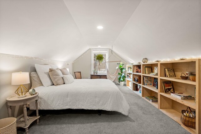 carpeted bedroom featuring lofted ceiling