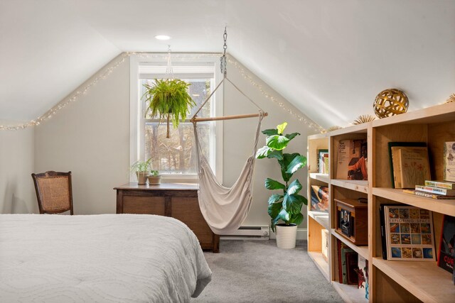 bedroom featuring vaulted ceiling, baseboard heating, and carpet