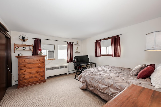 bedroom with radiator heating unit, baseboard heating, and light colored carpet