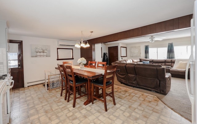 dining space with a baseboard radiator, ceiling fan with notable chandelier, and a wall mounted air conditioner