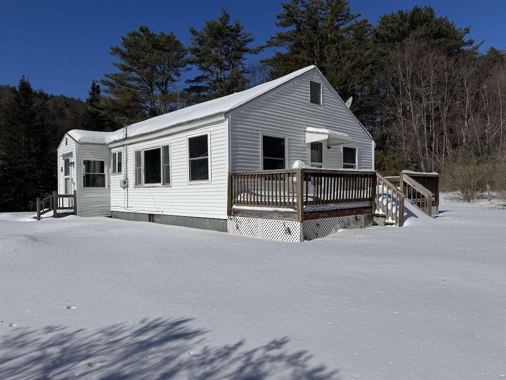 view of front of home featuring a wooden deck