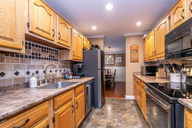 kitchen featuring recessed lighting, a sink, ornamental molding, appliances with stainless steel finishes, and tasteful backsplash