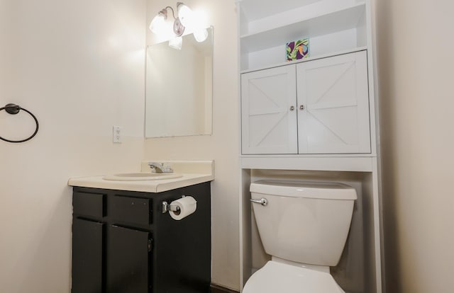 bathroom featuring toilet and vanity