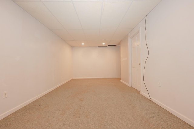 finished basement with a drop ceiling, recessed lighting, carpet flooring, and baseboards