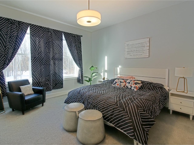 carpeted bedroom with baseboards