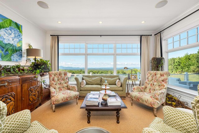 living room featuring ornamental molding, plenty of natural light, and recessed lighting