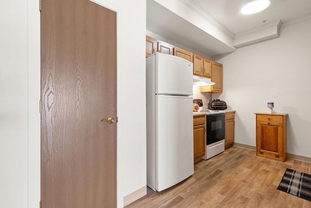 kitchen featuring light wood-style flooring, range with electric cooktop, light countertops, ornamental molding, and freestanding refrigerator