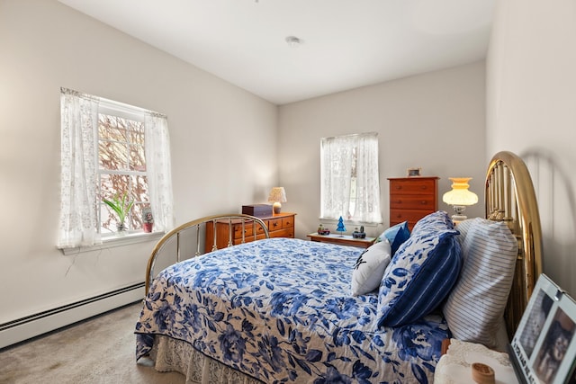 bedroom featuring carpet floors and a baseboard radiator