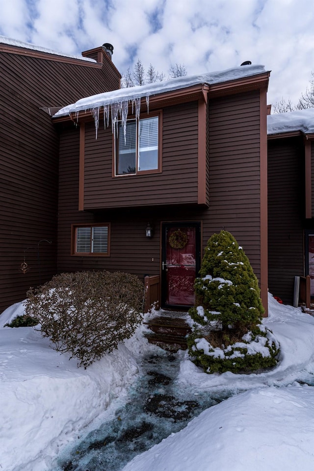 view of front facade featuring a chimney