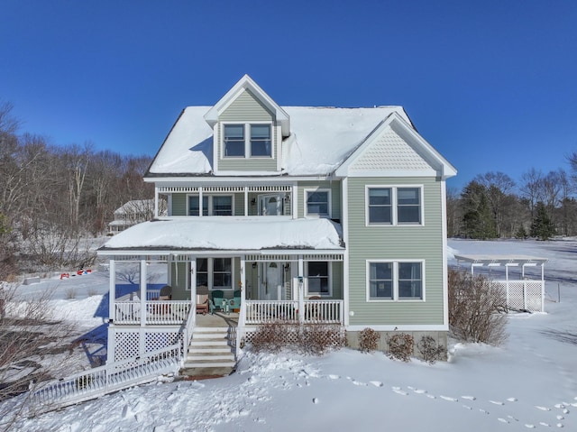 victorian house featuring covered porch