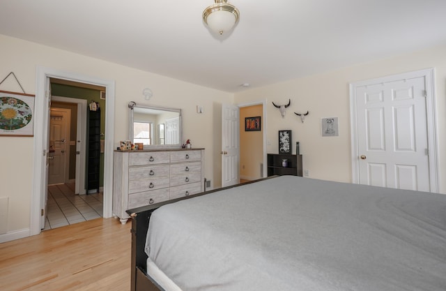 bedroom featuring wood finished floors