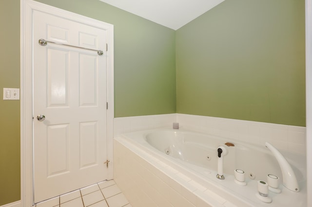 bathroom featuring a tub with jets and tile patterned floors