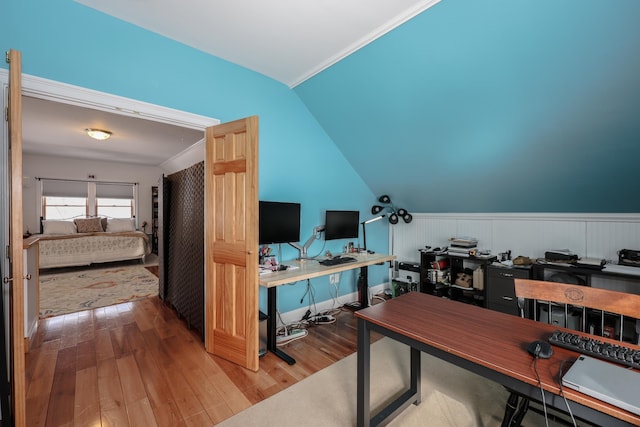 office with vaulted ceiling, baseboards, and wood finished floors