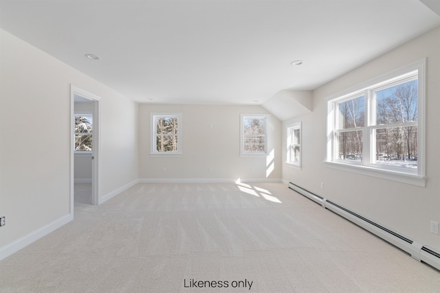 interior space featuring recessed lighting, baseboards, baseboard heating, and light colored carpet