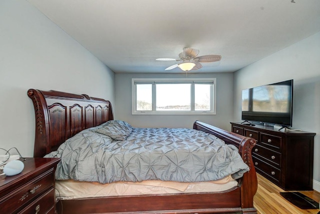 bedroom featuring light wood finished floors and ceiling fan