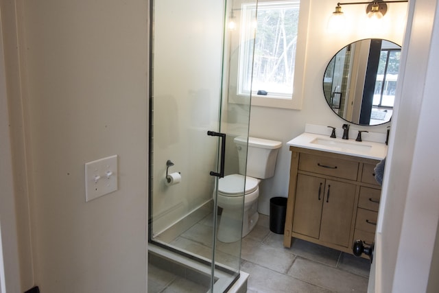 full bath with a stall shower, vanity, and toilet