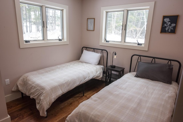 bedroom with dark wood-style floors