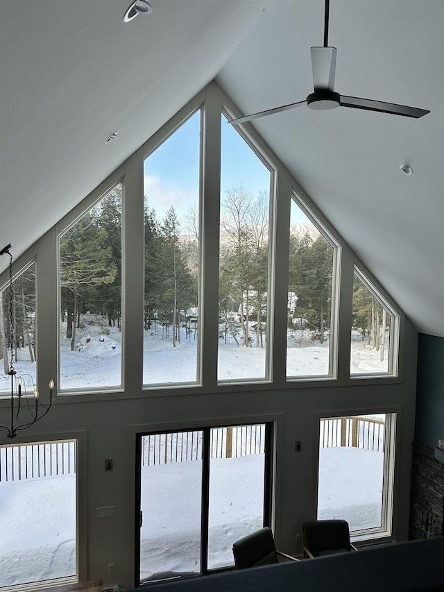 interior space with vaulted ceiling and a ceiling fan