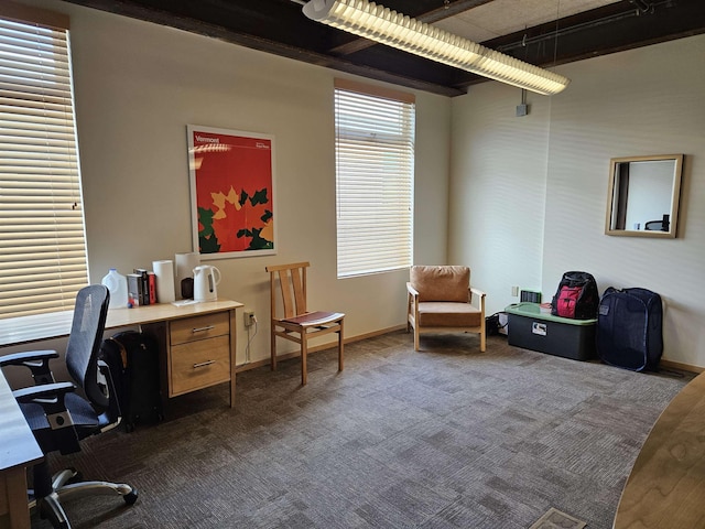 office space featuring baseboards and dark colored carpet