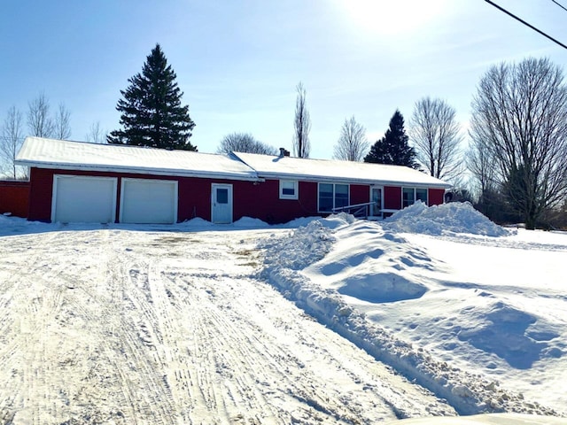 ranch-style house featuring an attached garage