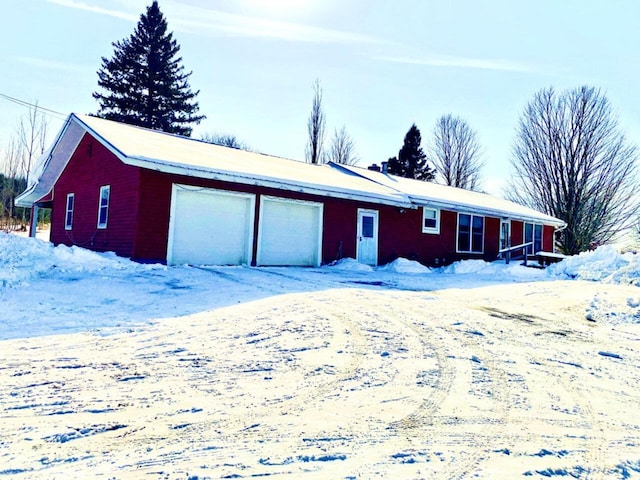 view of snow covered garage